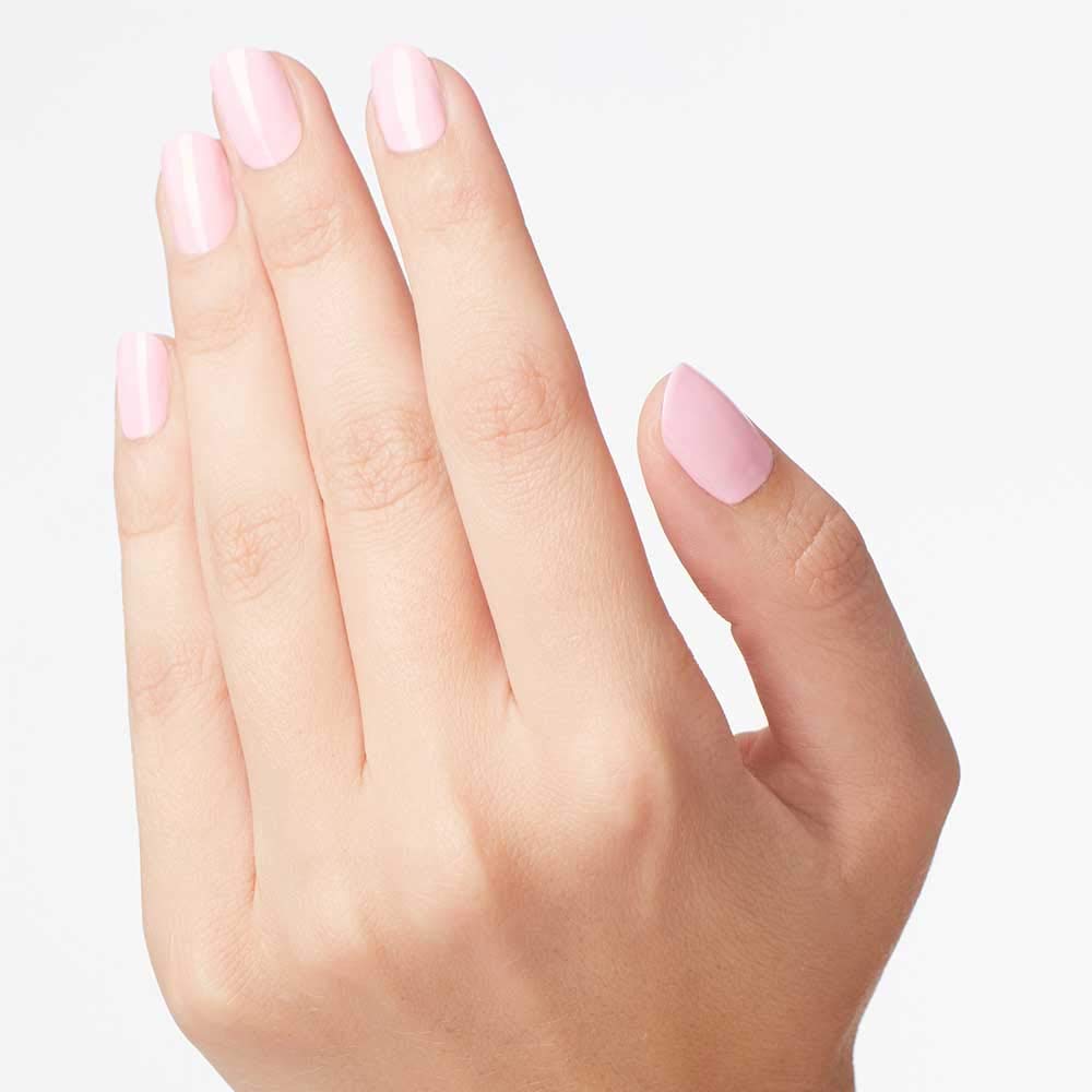 Hand applying OPI Mod About You showing streak-free finish and salon look benefit