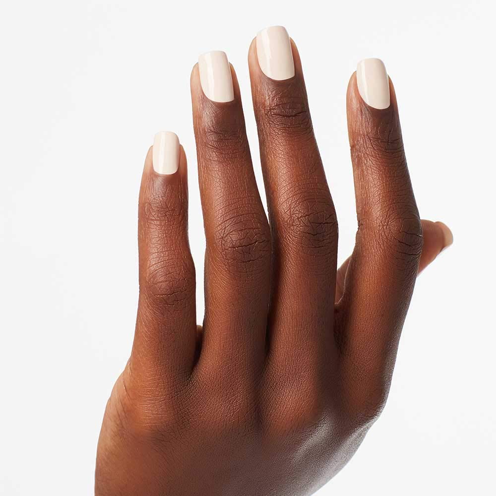 Model hand wearing OPI My Vampire is Buff in lifestyle setting illustrating polished everyday look
