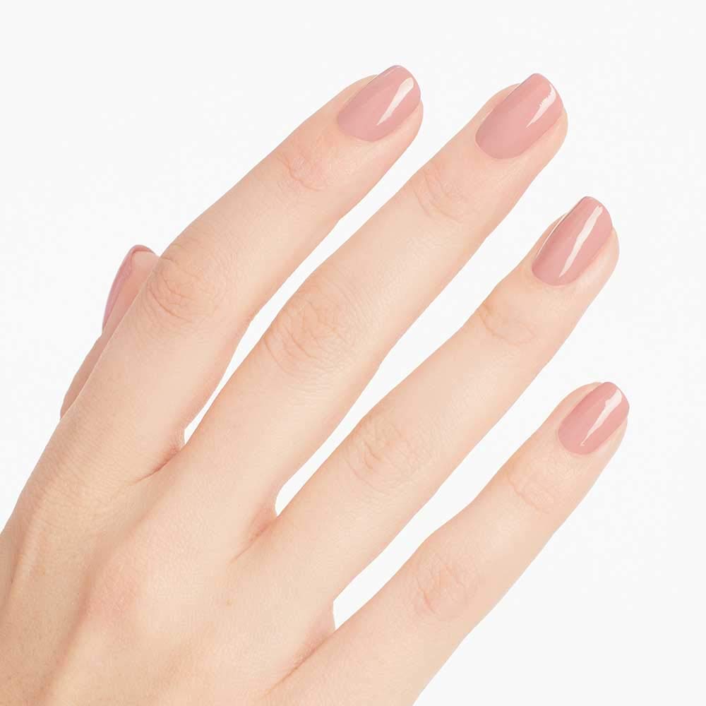 close-up nails with two coats of OPI soft pink showing chip resistance benefit