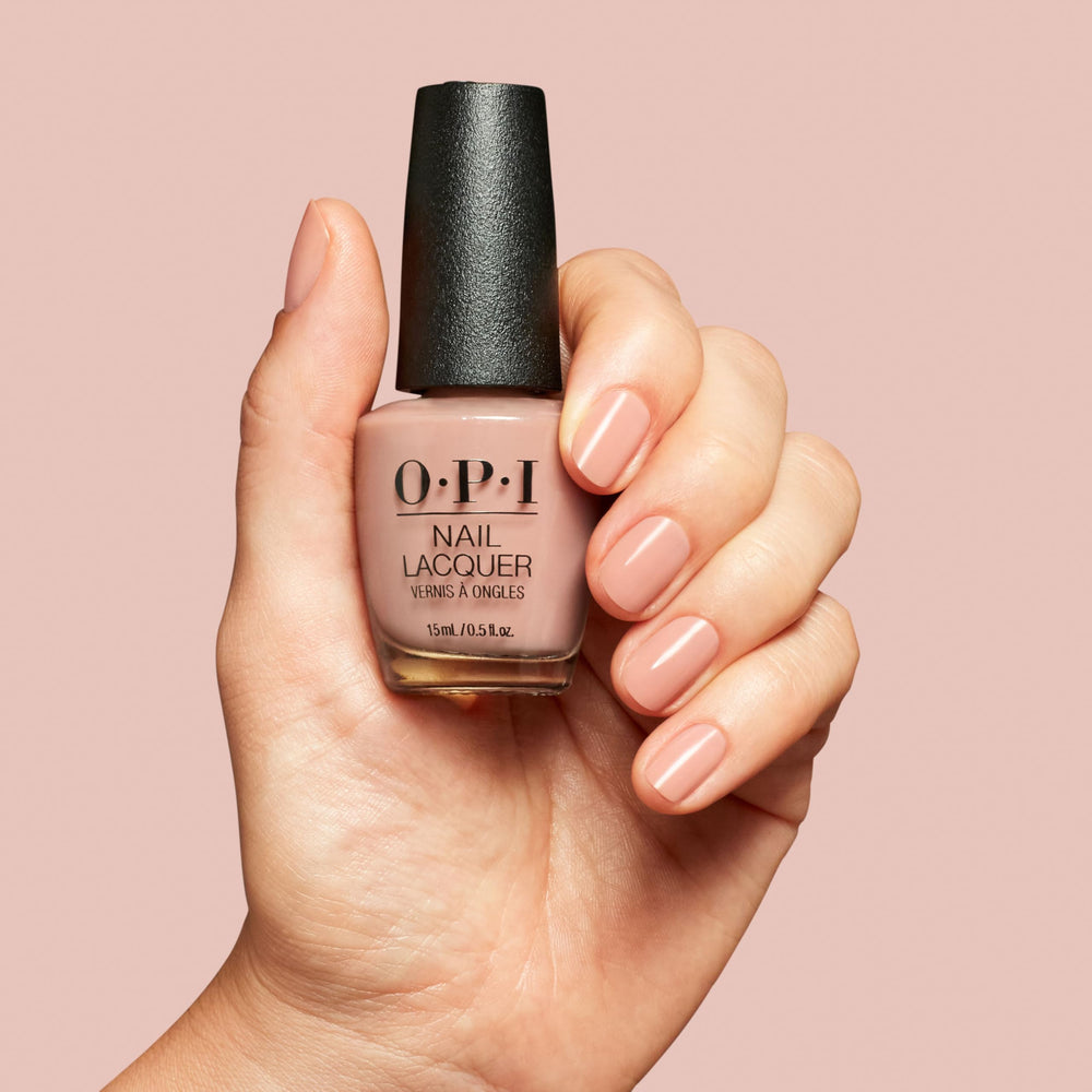 OPI bottle cap and label detail showing brand and travel-ready size benefit