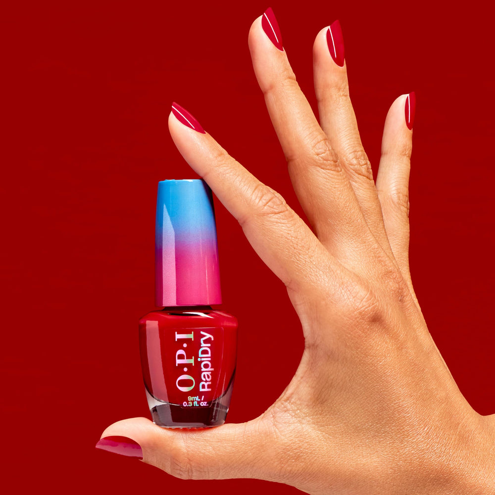 Hand model wearing OPI red manicure demonstrating smudge-resistant result