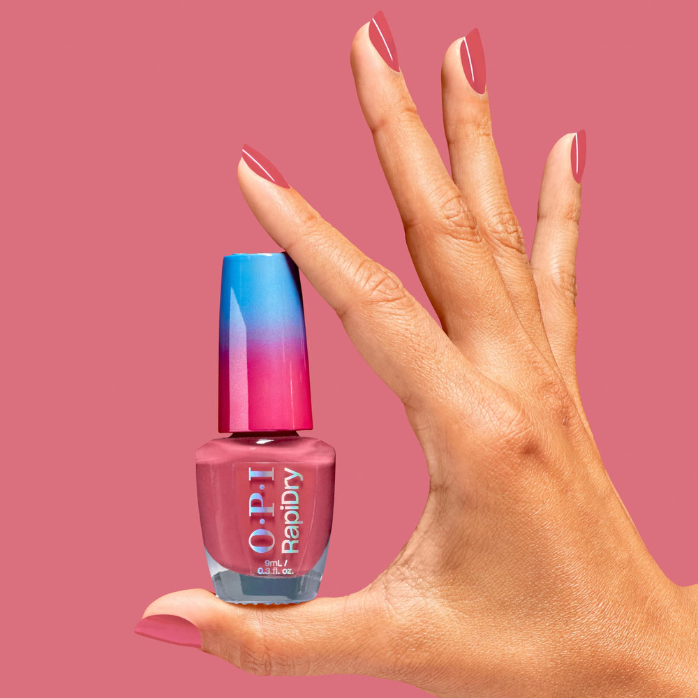 OPI on nails lifestyle image, shows glossy soft red manicure ready in minutes