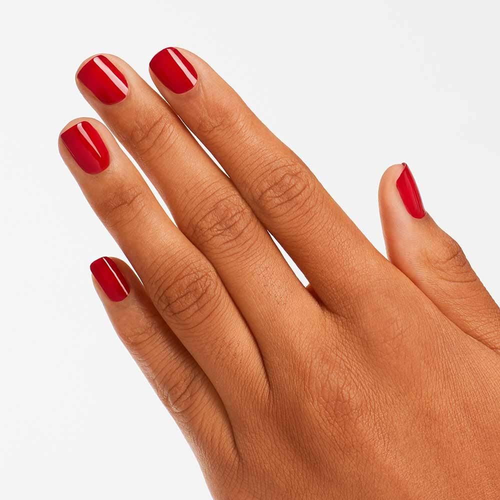 OPI painted nails in use showing durable red polish for everyday wear