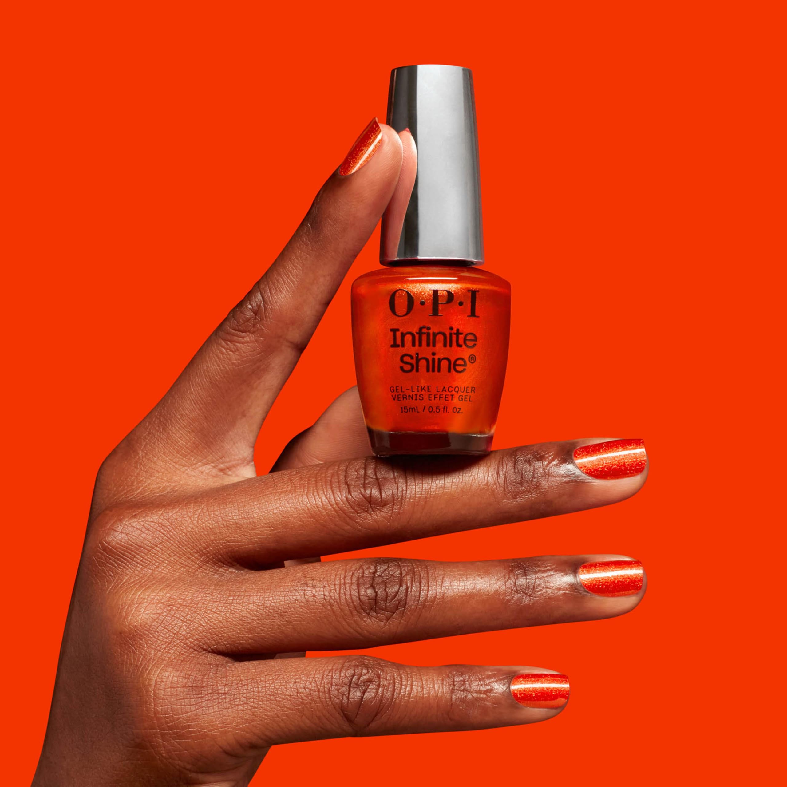 OPI bottle next to a coin showing compact size and travel-friendly bottle