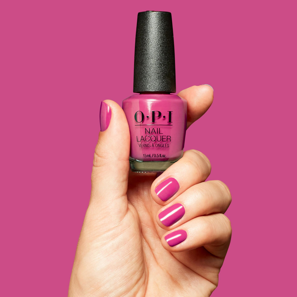 manicure close-up with OPI Strawberry Cosmo highlighting polished shine