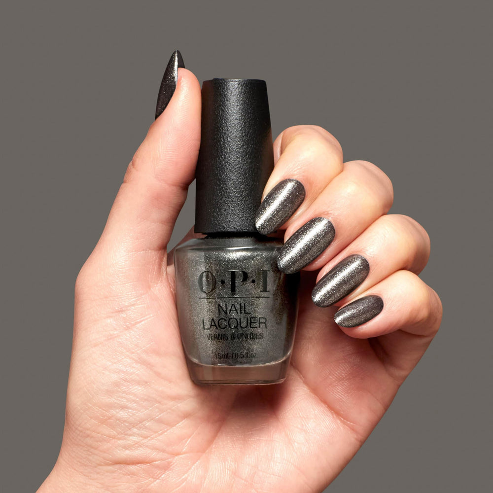 Hand holding OPI bottle to show Tempted to Lick-orice bottle size and usability