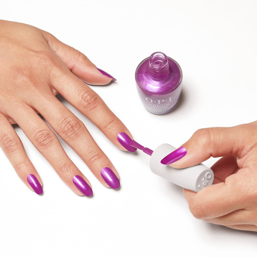 Nail technician applying Thistle Make You Bloom in salon for long-lasting wear