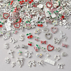 OPMADM front packaging showing 100-piece silver nail charms and variety benefit