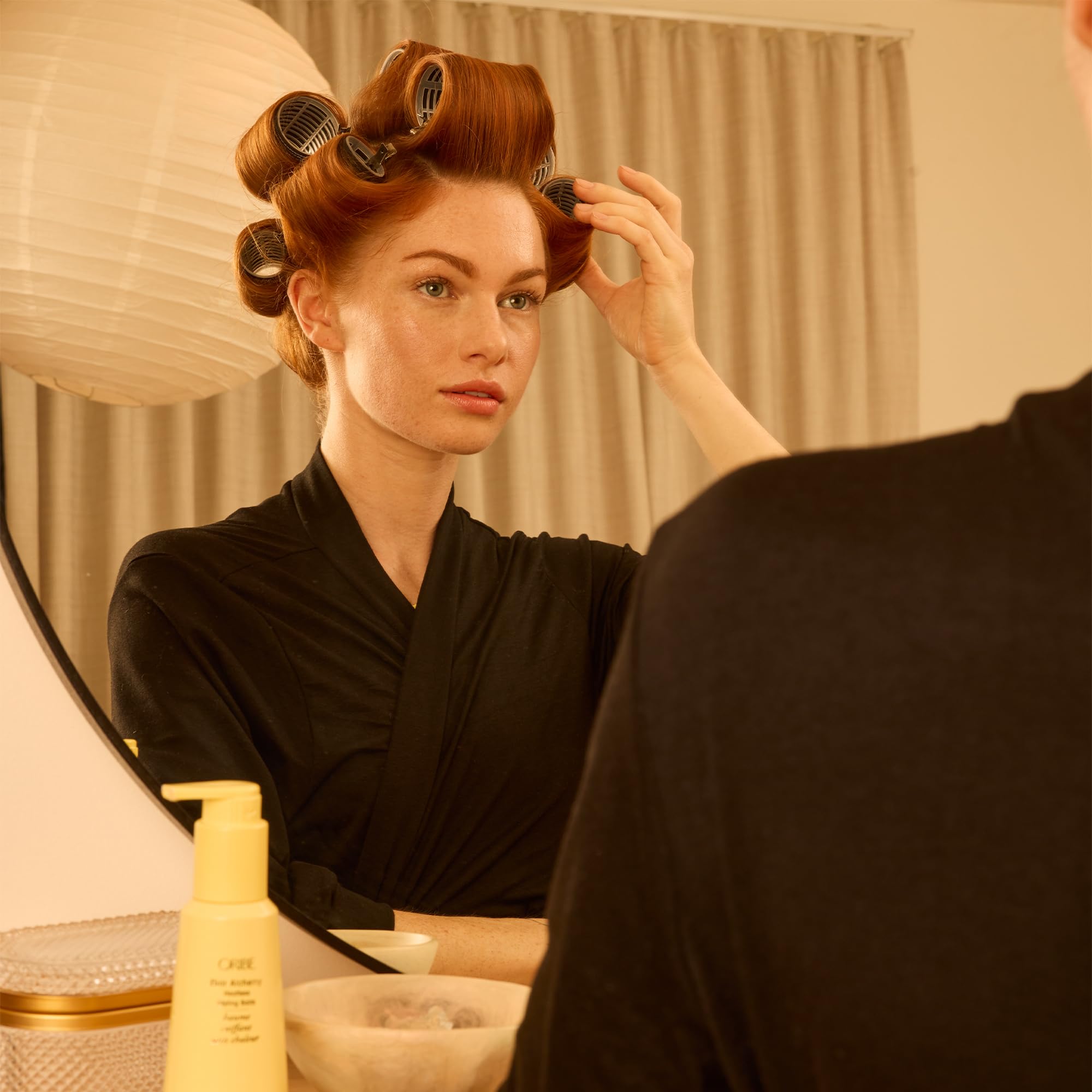 ORIBE ingredients label close-up emphasizing clean formula and treatment-safe benefit