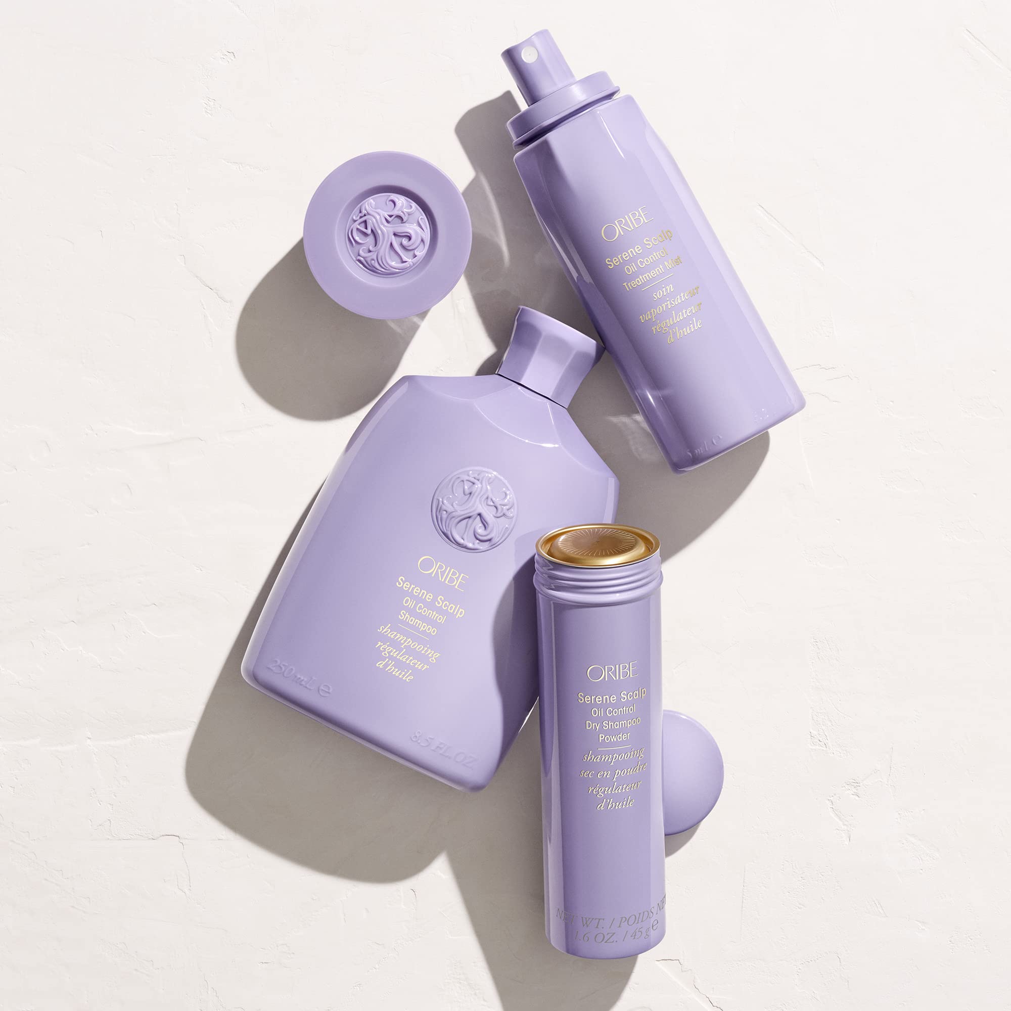 ORIBE bottle beside standard item size comparison for clear volume understanding