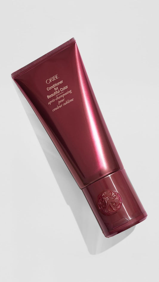 Oribe conditioner creamy texture closeup demonstrating moisturizing action