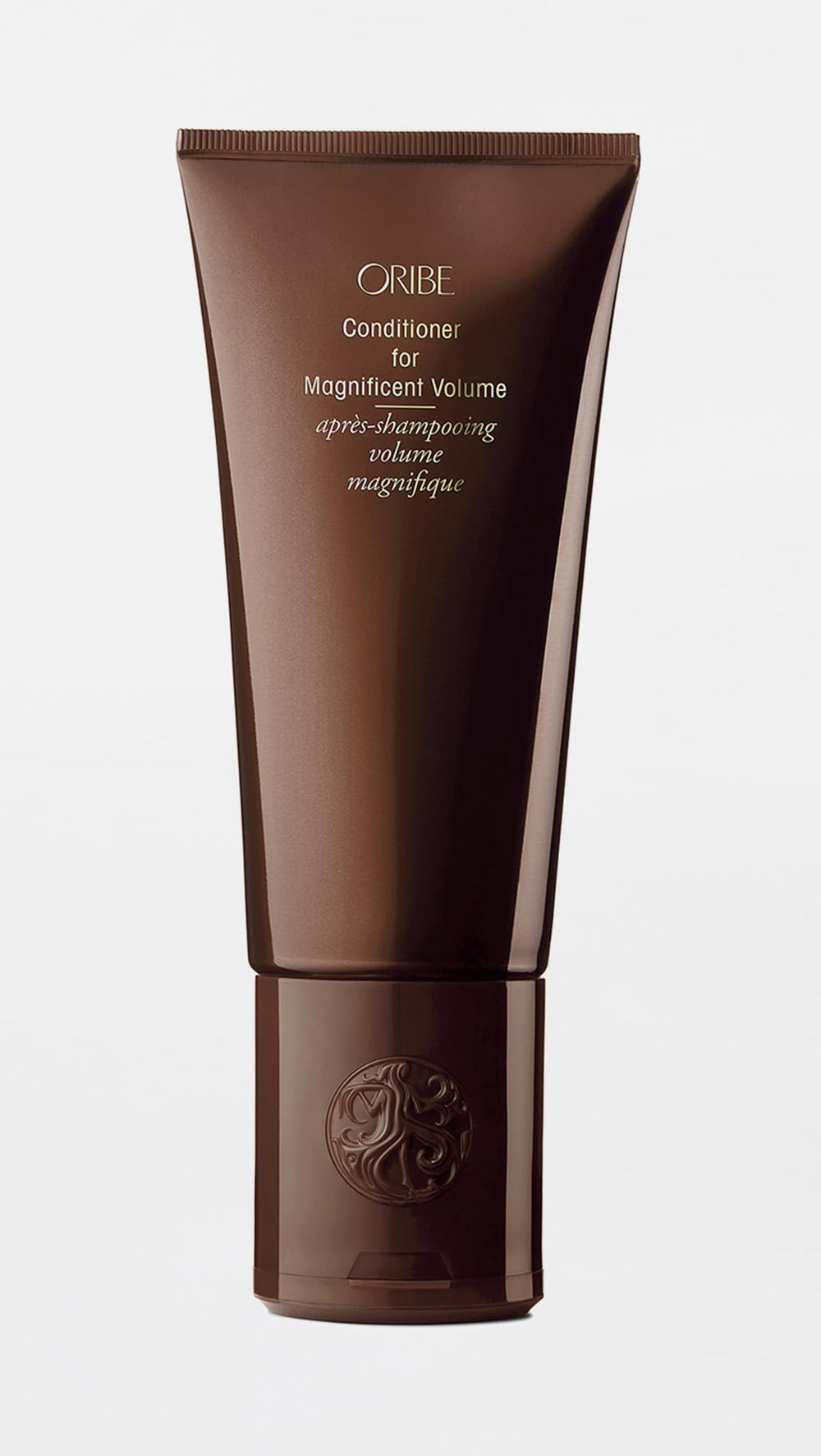 Oribe label and pump closeup highlighting formulation and easy dispensing benefit