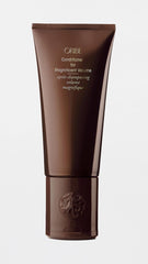 Oribe label and pump closeup highlighting formulation and easy dispensing benefit