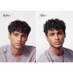 Oribe being smoothed into damp hair demonstrating even application benefit