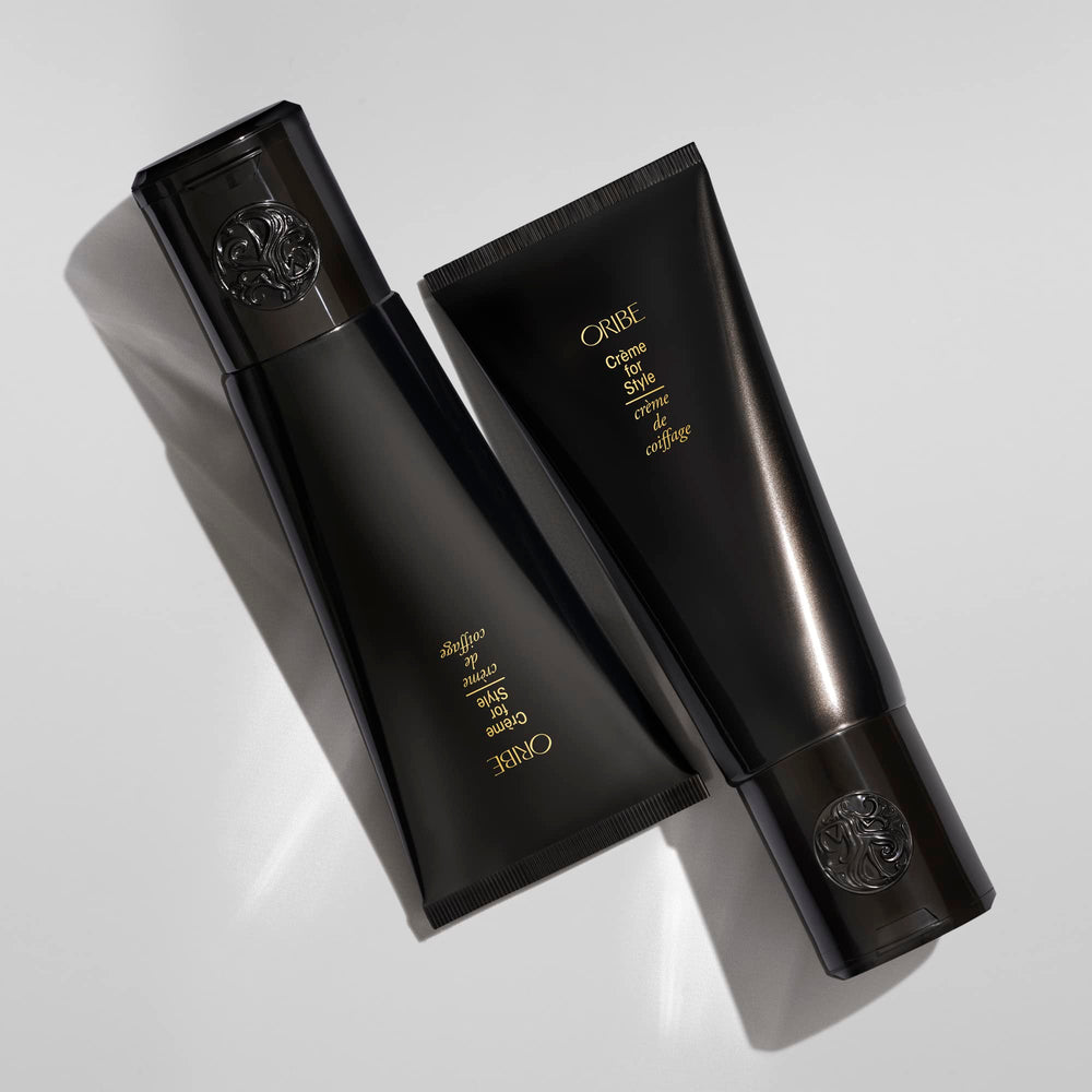 Oribe 5 oz jar next to common objects to show scale and portability