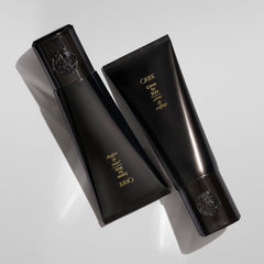 Oribe 5 oz jar next to common objects to show scale and portability