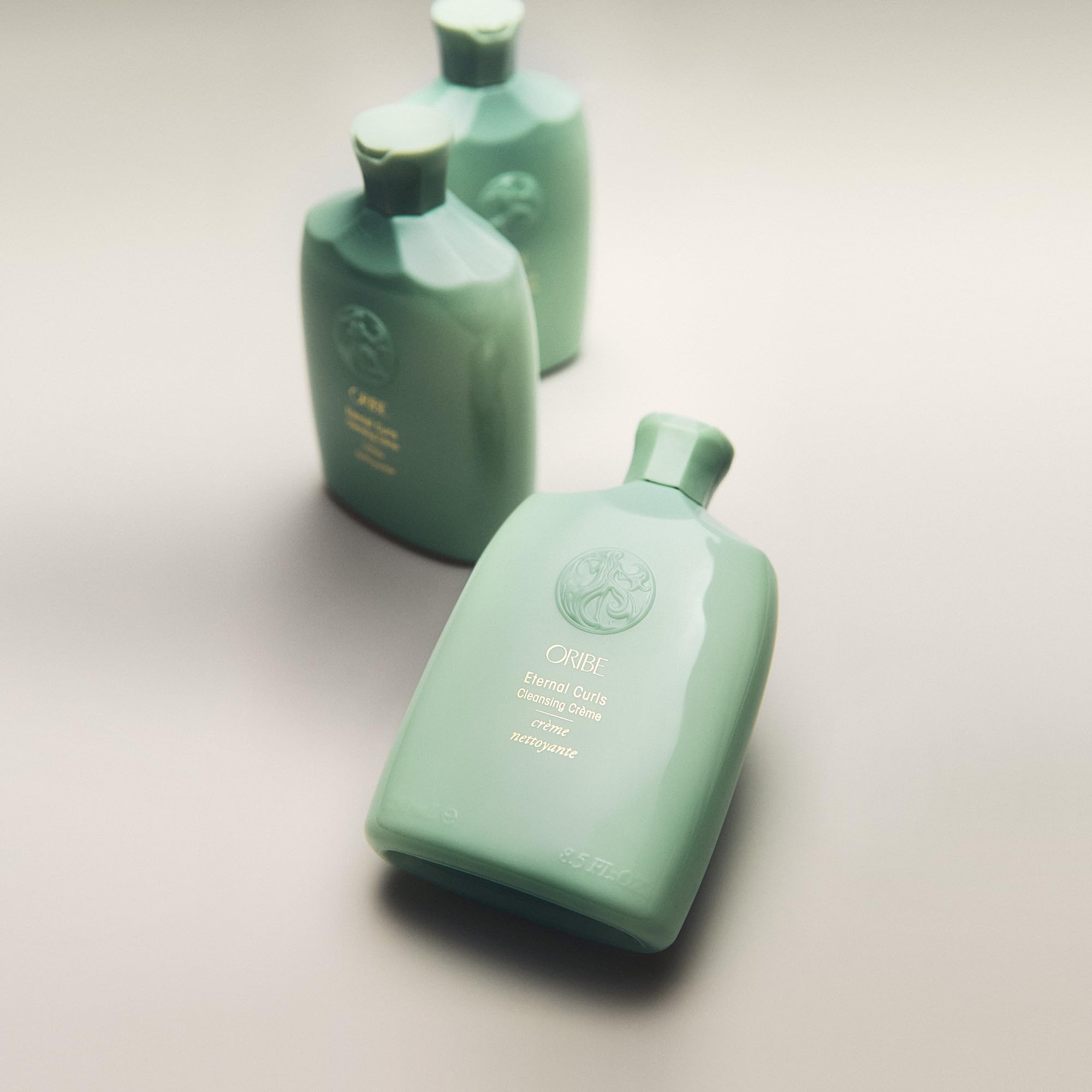 Oribe Eternal Curls in hand during application showing gentle cleanse benefit