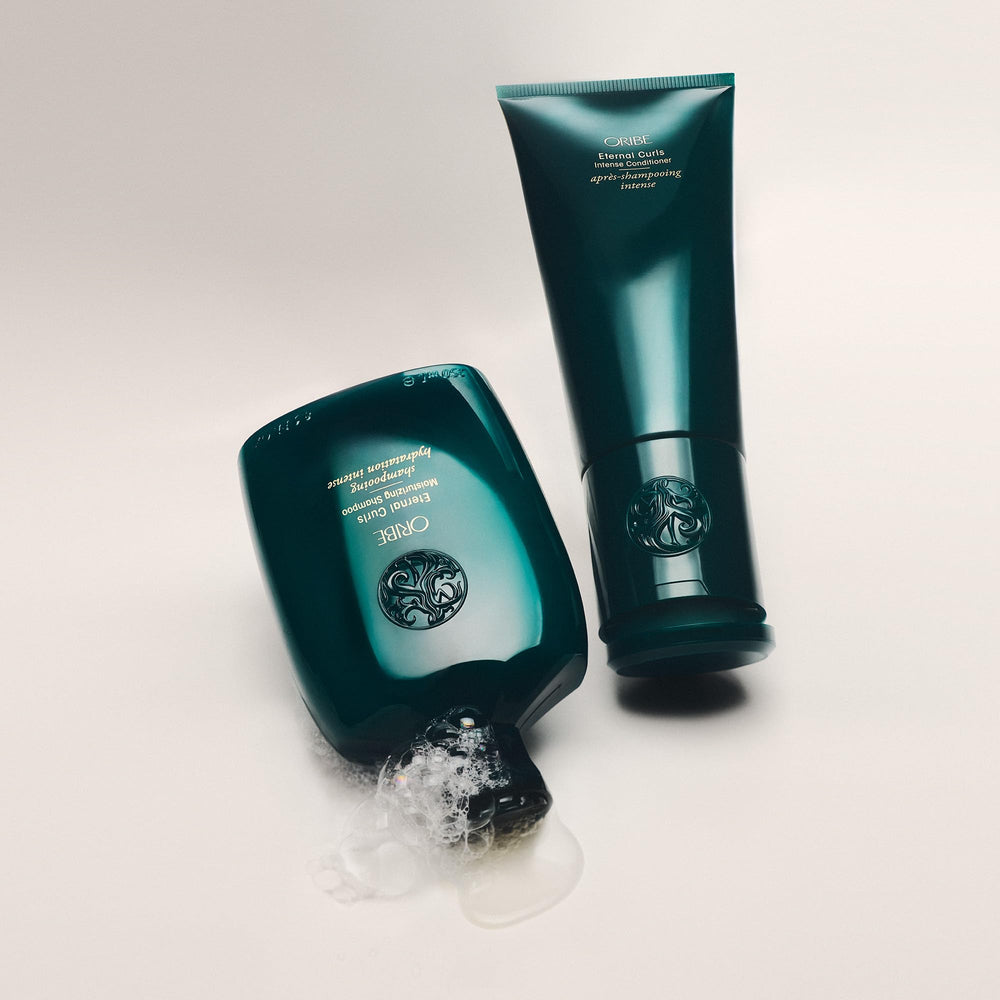 Oribe Eternal Curls in-shower bottle on ledge showing convenient use