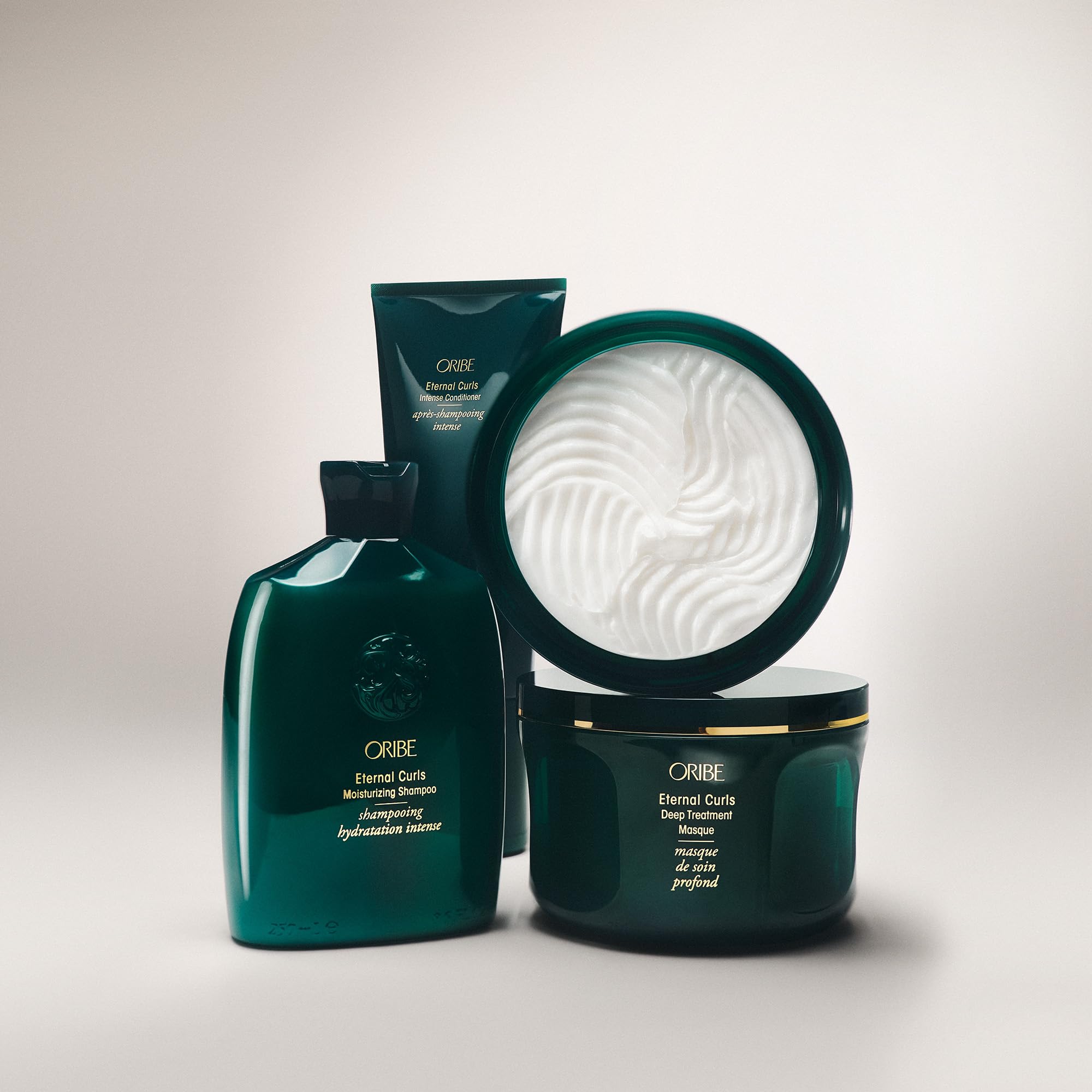 ORIBE lifestyle shot of curly-haired person showing softer, defined curls