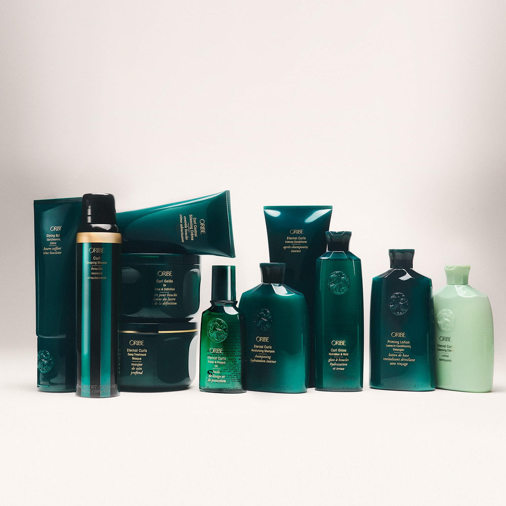 Oribe Eternal Curls on shower shelf in lifestyle setting showing premium routine benefit