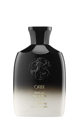 ORIBE Gold Lust Conditioner pump detail showing creamy formula and detangling benefit