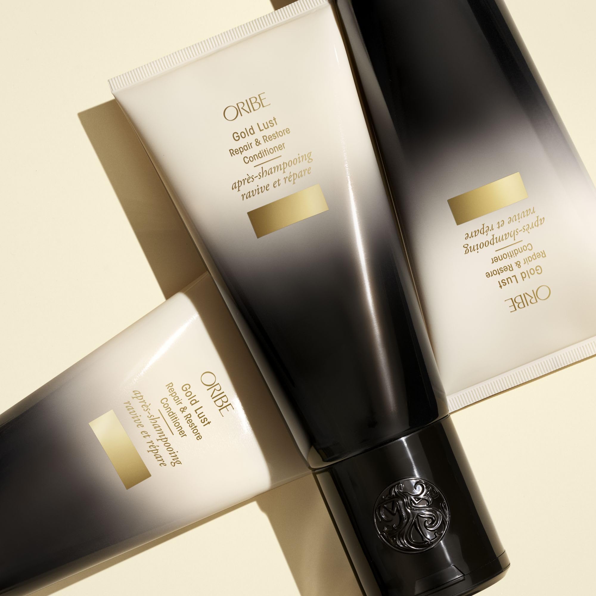 Oribe Gold Lust conditioner next to ruler showing 6.8oz scale for size clarity