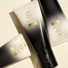Oribe Gold Lust conditioner next to ruler showing 6.8oz scale for size clarity