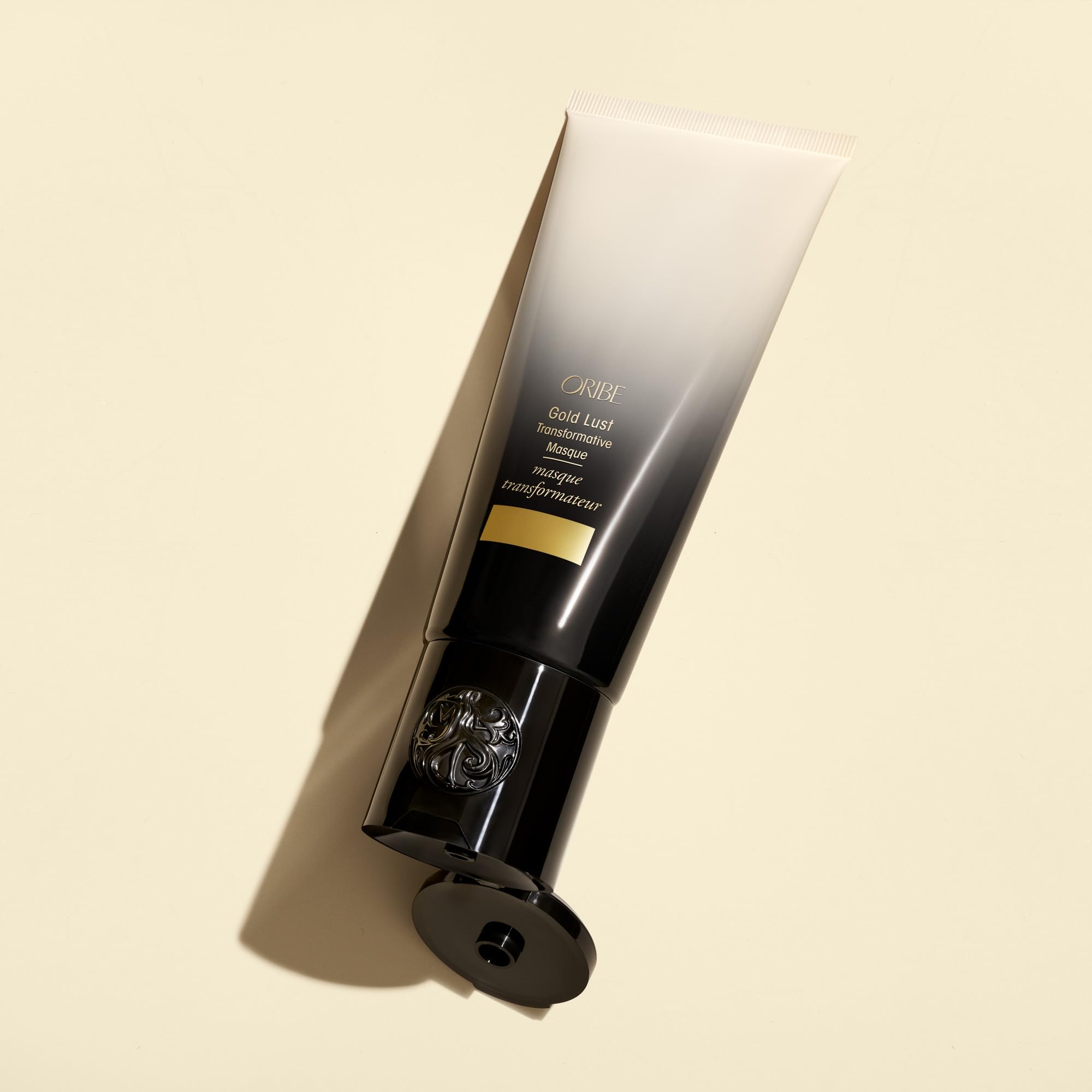 Oribe Gold Lust Mask styled with flowers to evoke Côte d’Azur fragrance benefit