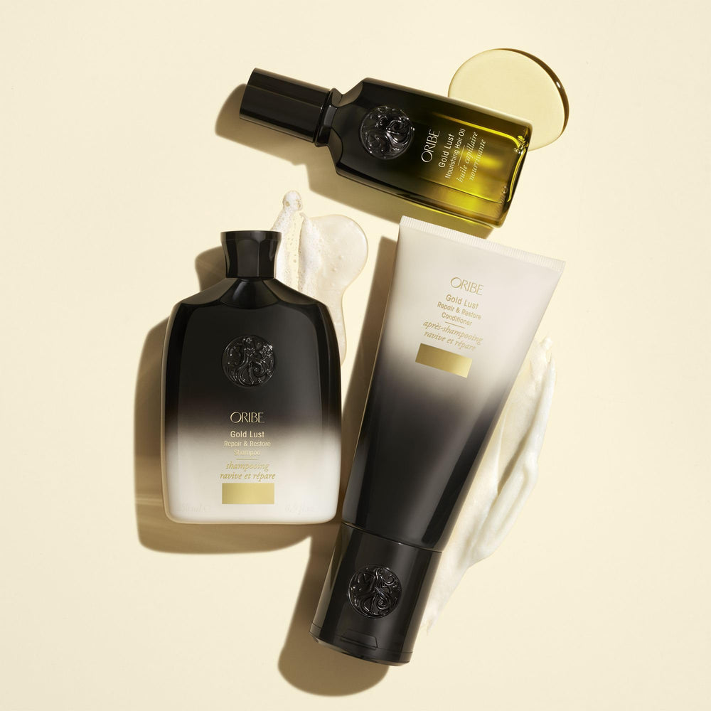 Stylist applying Oribe Gold Lust Oil in salon showing smoothing and manageability