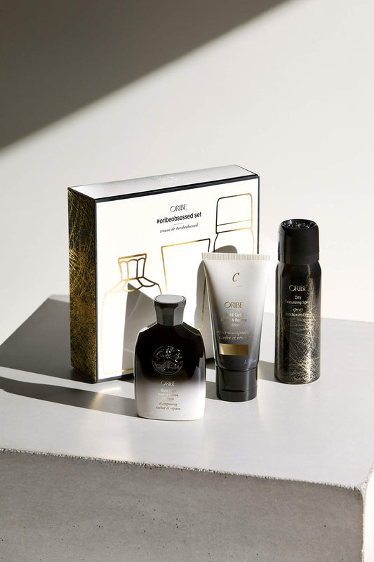 ORIBE Gold Lust Shampoo close-up highlighting smooth texture and repairing benefit