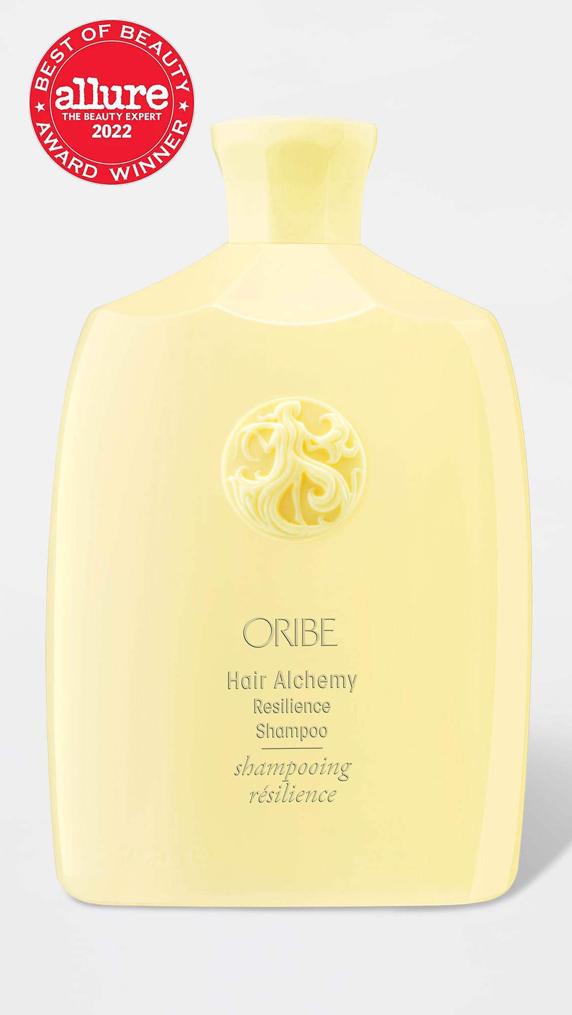 Oribe Hair Alchemy back label close-up listing ingredients and usage benefits