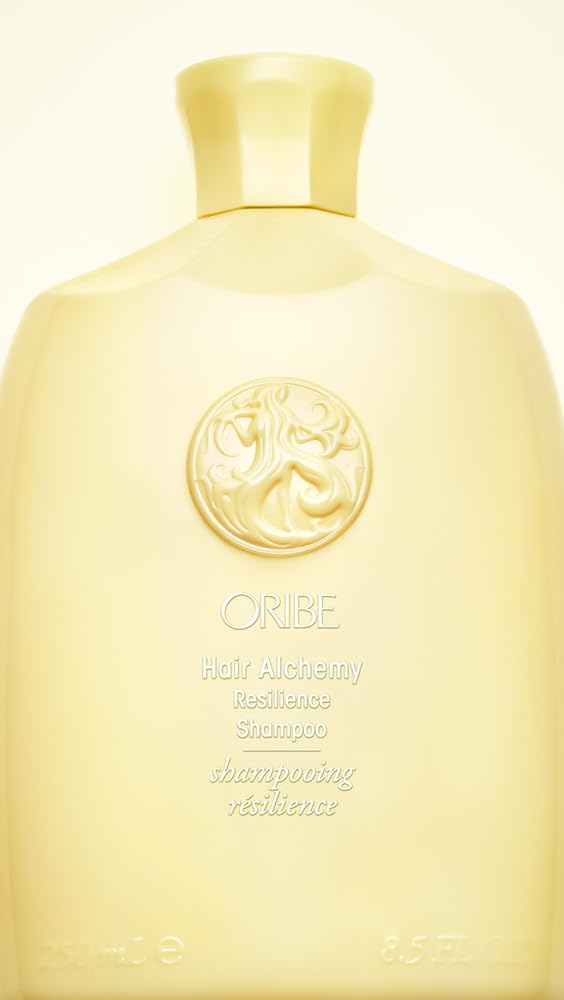 Oribe Hair Alchemy shampoo foam lather texture demonstrating gentle cleanse