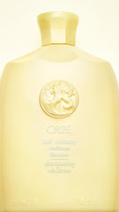 Oribe Hair Alchemy shampoo foam lather texture demonstrating gentle cleanse