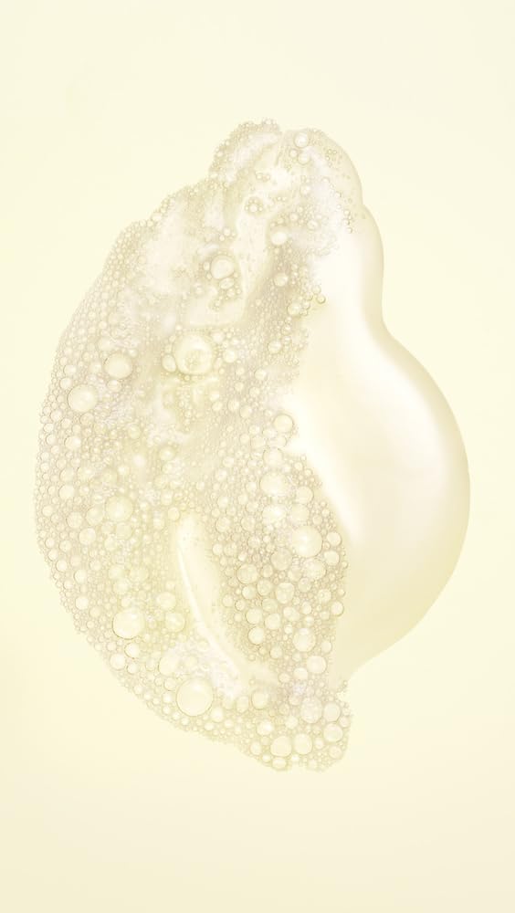 Oribe Hair Alchemy pump and cap detail illustrating easy dispensing