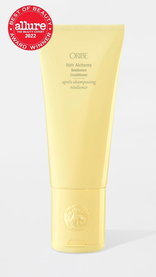 Oribe bottle pump dispensing conditioner, demonstrating easy dosing benefit
