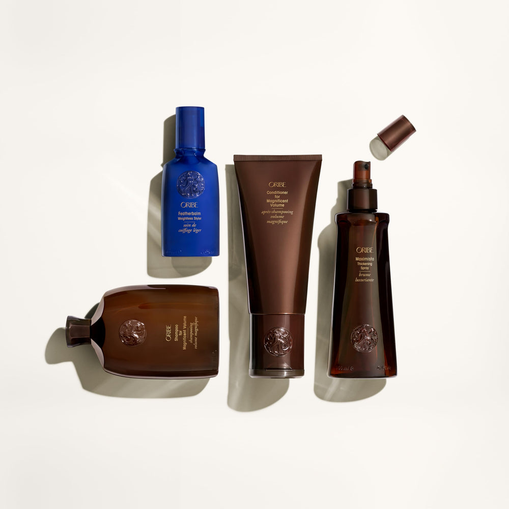 Oribe shampoo in shower being applied for lifted hair