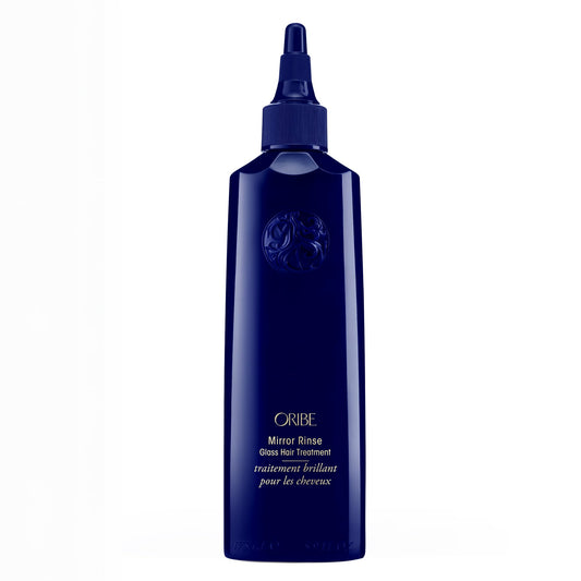 ORIBE front bottle shot showing elegant packaging and premium shine benefit