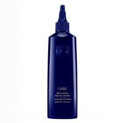ORIBE front bottle shot showing elegant packaging and premium shine benefit
