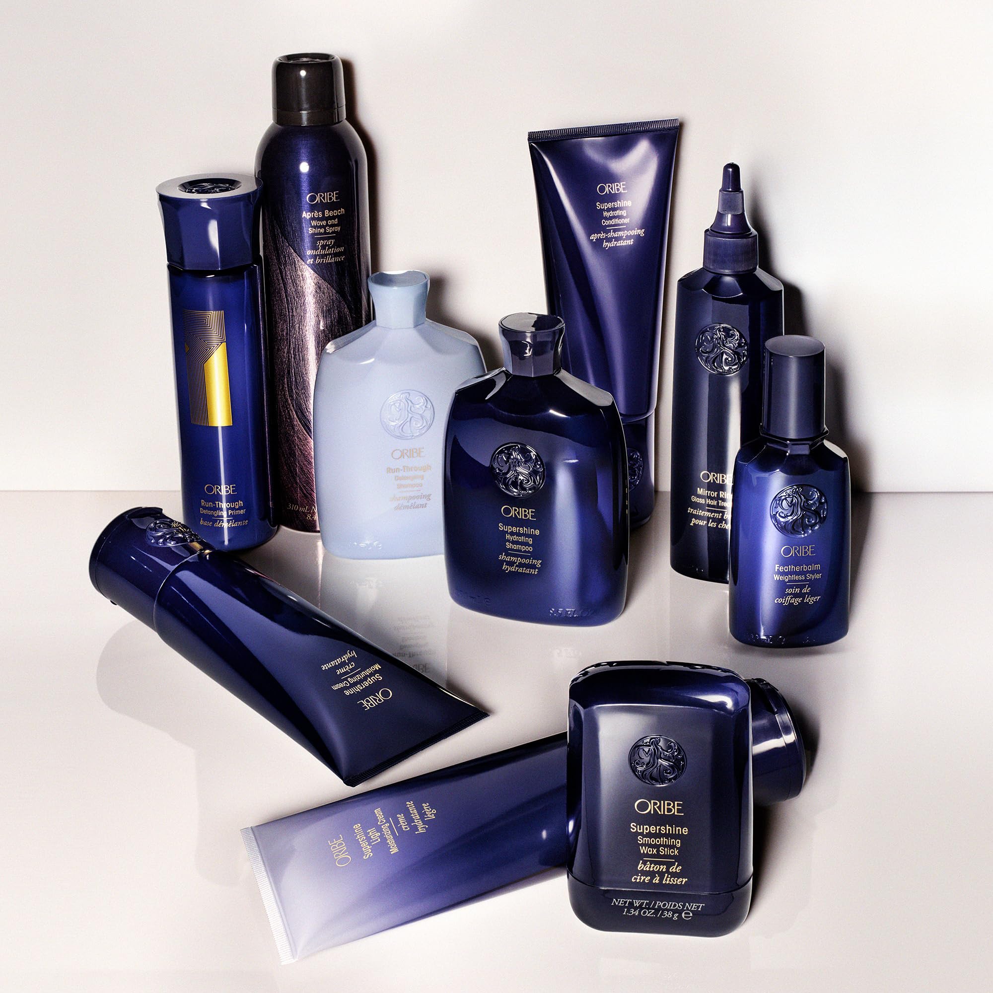 Oribe Supershine Light on bathroom shelf in lifestyle setting suggesting daily use