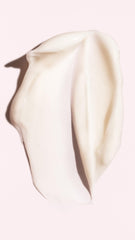 Oribe conditioner texture close-up demonstrating creamy hydration and smoothing benefit