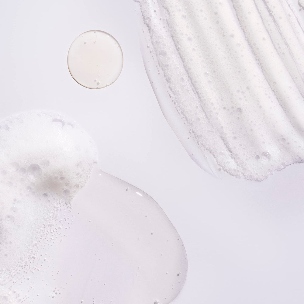 ORIBE shampoo lather texture close-up highlighting gentle cleansing action