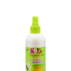 Originals by Africa's Best detangler in use while combing a child's hair reducing breakage