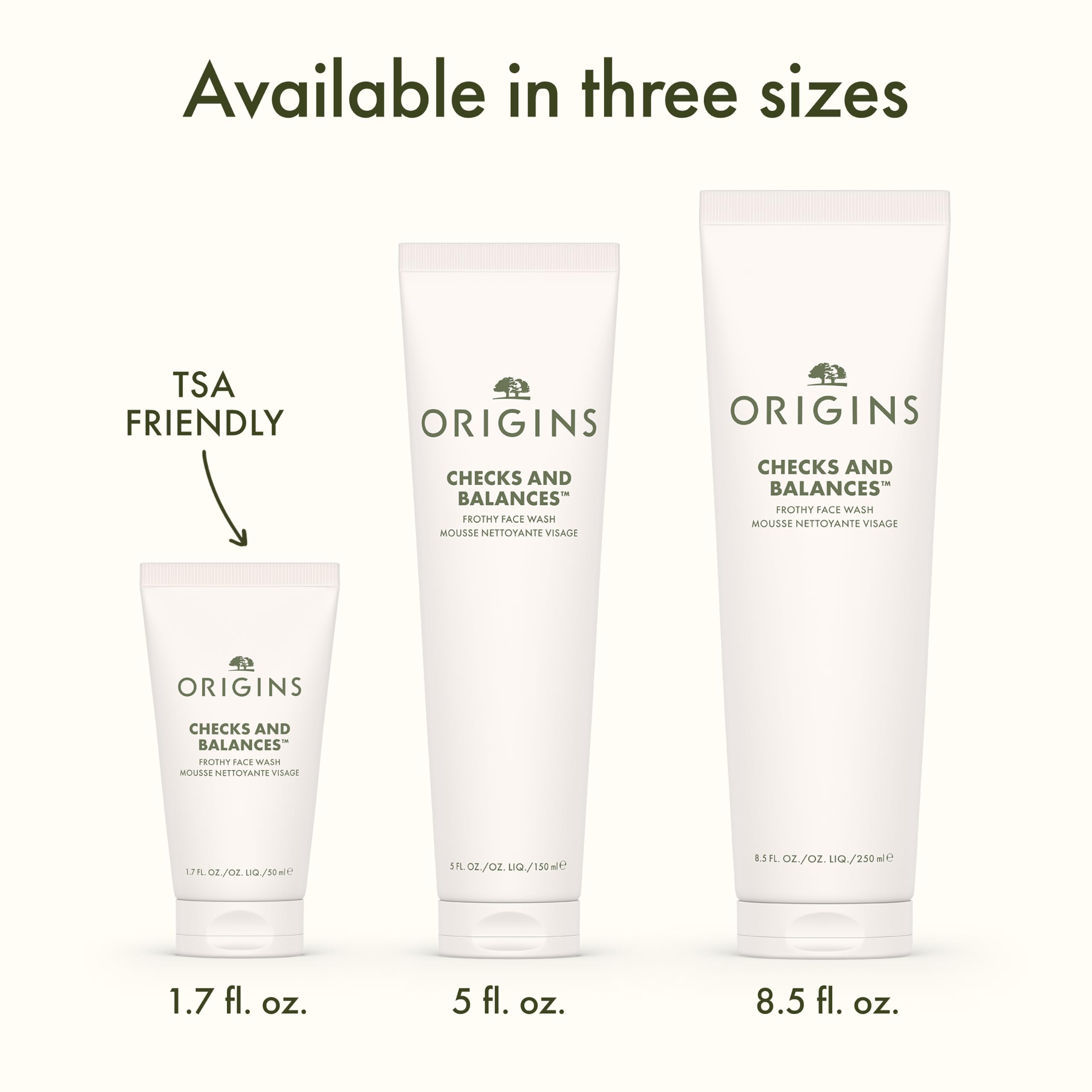 Origins bottle beside spearmint leaves emphasizing minty freshness benefit