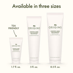 Origins bottle beside spearmint leaves emphasizing minty freshness benefit