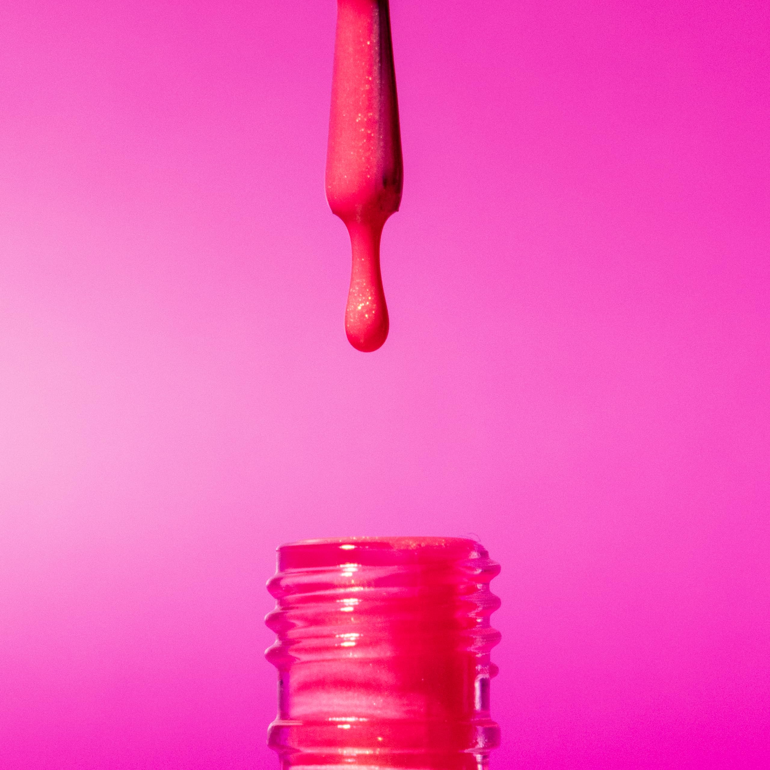 Orly The Floor Is Lava painted nails in lifestyle scene for vibrant look