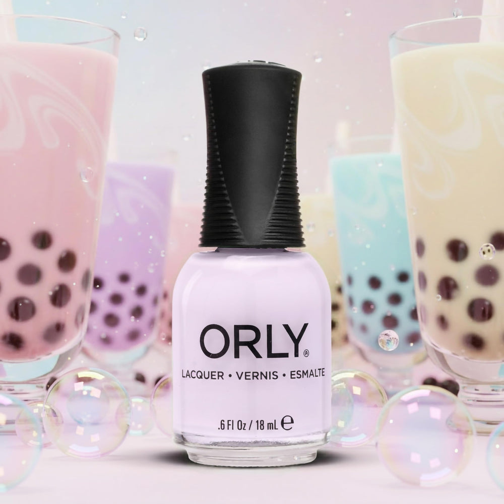 Orly Ube Cloud lifestyle flatlay with bottle and accessories suggesting effortless at-home manicure