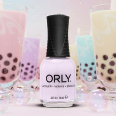 Orly Ube Cloud lifestyle flatlay with bottle and accessories suggesting effortless at-home manicure