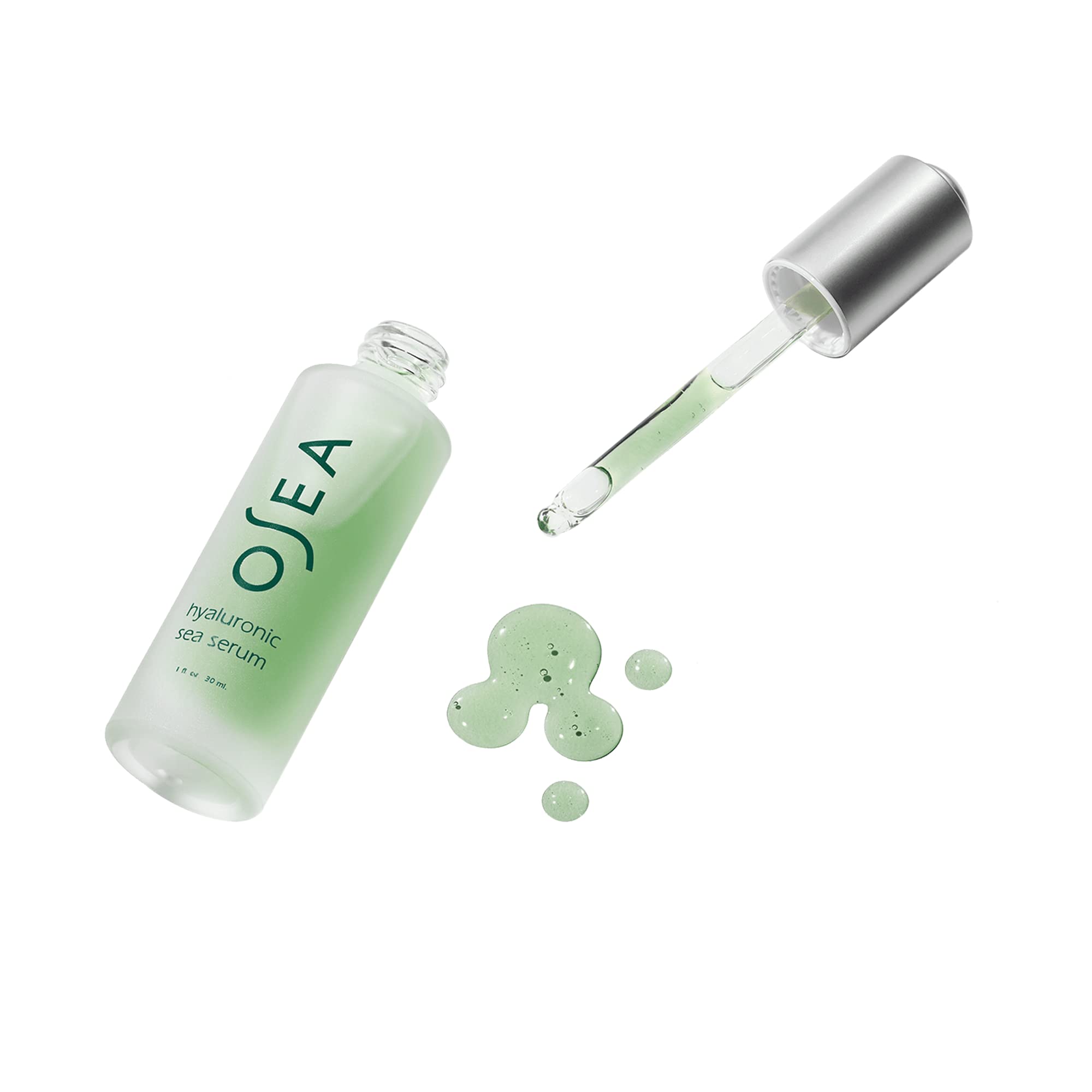 OSEA 1 oz bottle shown beside a coin for size comparison and travel-friendly benefit