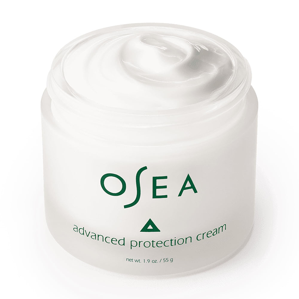 OSEA 1oz jar next to coin showing compact travel-friendly size benefit
