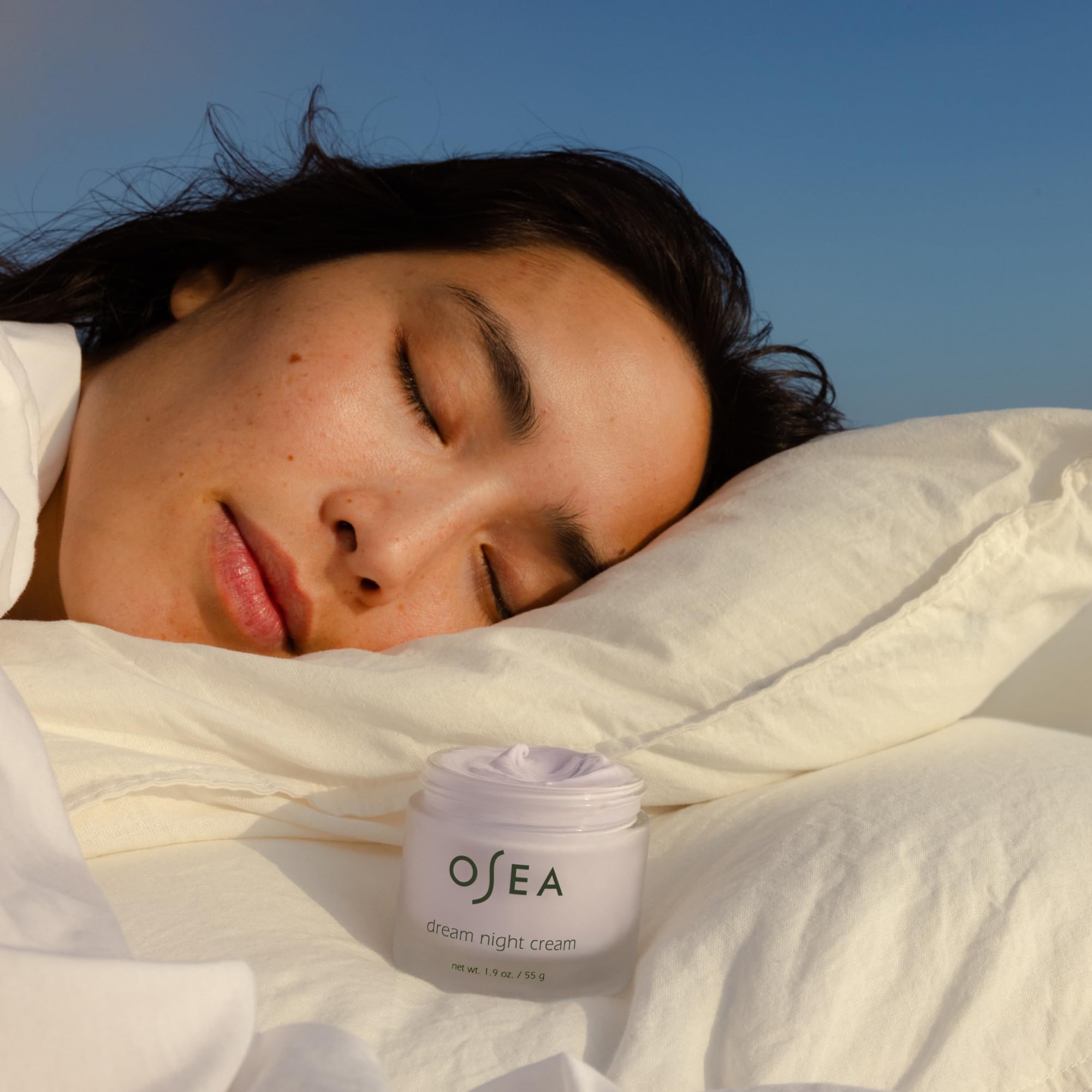 OSEA cream on hand demonstrating smooth application and quick absorption